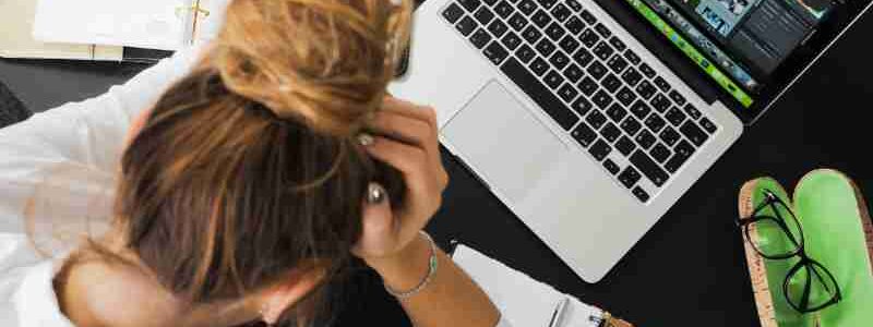 Overhead view of a stressed woman working at a desk with a laptop, phone, and notebooks., tags: zu und - pexel